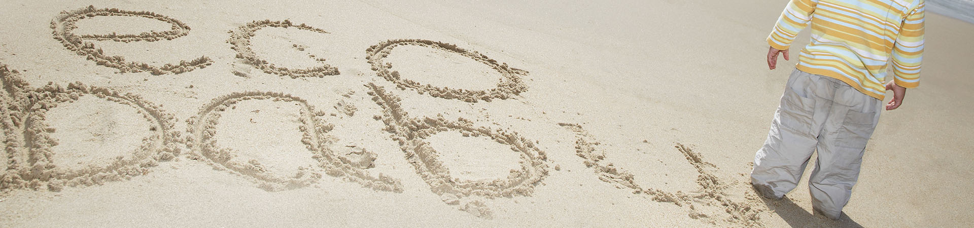 eco baby written on a beach