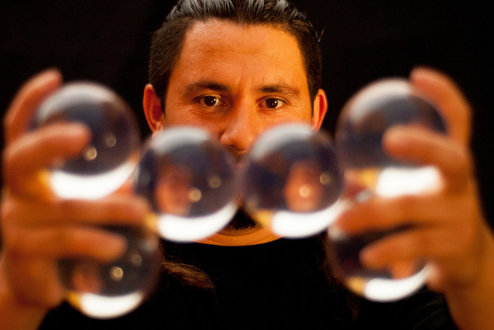 A man holding his glass balls