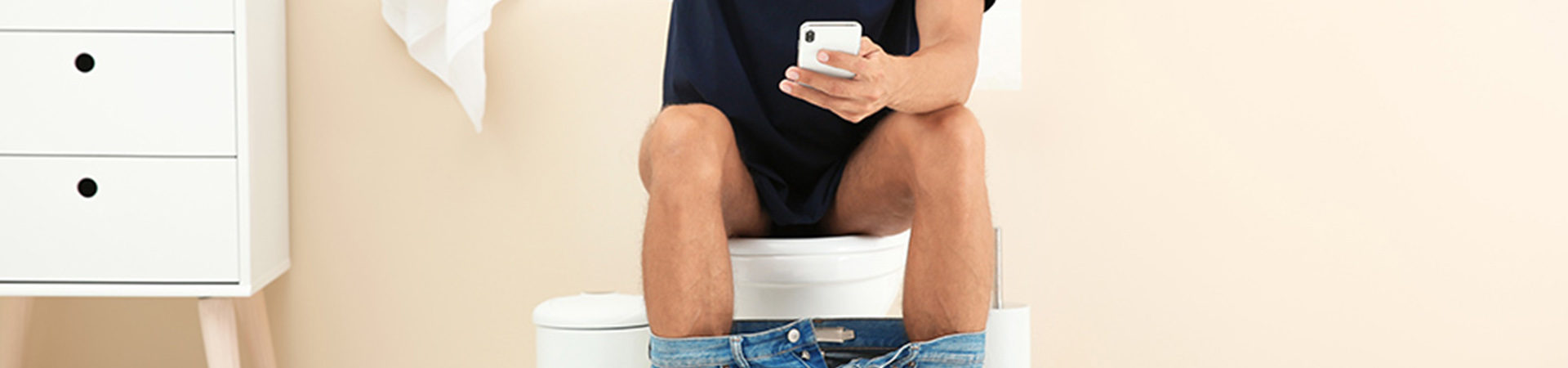 header of man on toilet with phone