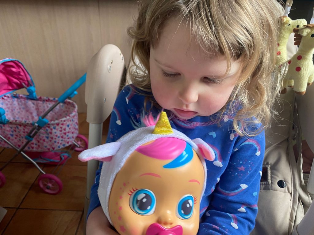 Cry Baby Review, millie playing with her unicorn crybaby