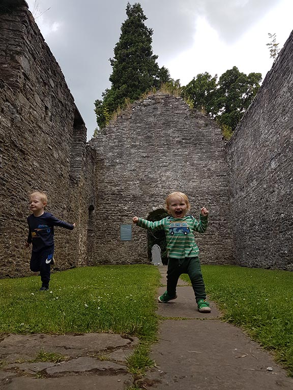 boys running in Blair Castle grounds