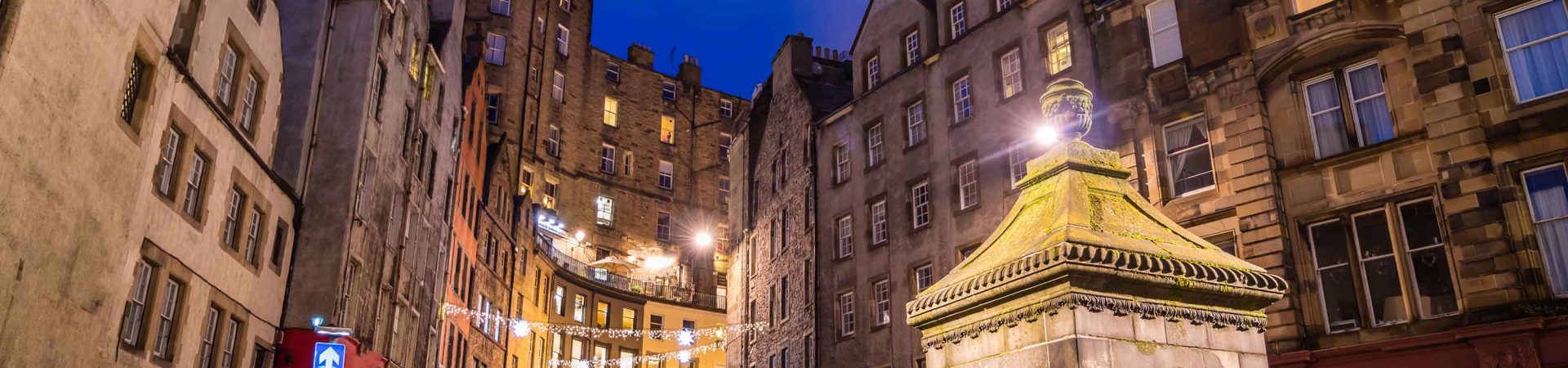 An Edinburgh street lit up at night